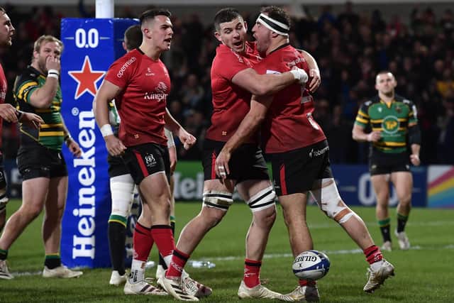 BELFAST, NORTHERN IRELAND - DECEMBER 17: Ulster hooker Rob Herring (r) is congratulated by team mates after scoring the first try during the Heineken Champions Cup match between Ulster Rugby and Northampton Saints at Kingspan Stadium on December 17, 2021 in Belfast, Northern Ireland. (Photo by Charles McQuillan/Getty Images)