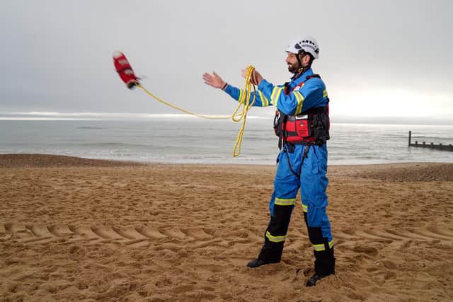 Coastguard Coastal Operations Area Commander Tom Wright casts a throwline on Southbourne beach in Dorset. Coastguards around the country are marking the 200th anniversary of the service dedicated to saving lives at sea. To mark the milestone, 200 throwlines - part of the standard lifesaving kit - will be cast by coastguards around the country as a symbol of the service's dedication