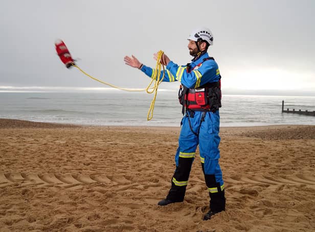Coastguard Coastal Operations Area Commander Tom Wright casts a throwline on Southbourne beach in Dorset. Coastguards around the country are marking the 200th anniversary of the service dedicated to saving lives at sea. To mark the milestone, 200 throwlines - part of the standard lifesaving kit - will be cast by coastguards around the country as a symbol of the service's dedication