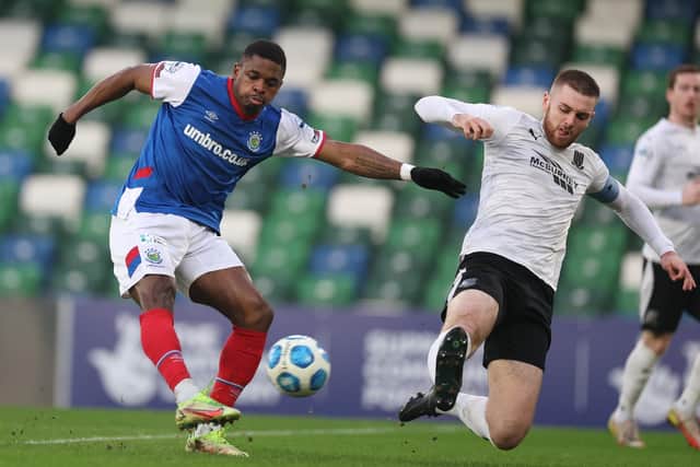 Linfield's Christy Manzinga (left) and Ballymena United's Conor Keeley competing at Windsor Park on Saturday. Pic by Pacemaker.