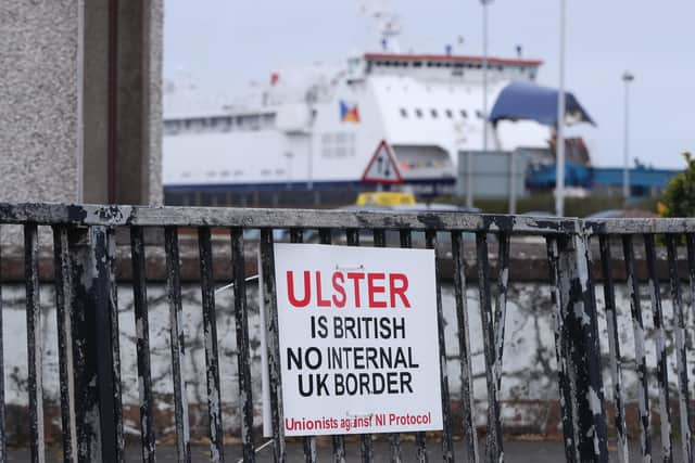 A sign protesting against the Northern Ireland Protocol in Larne Harbour, Northern Ireland.