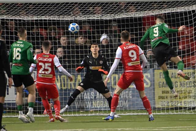 Jay Donnelly heads home his second goal in victory for Glentoran by 2-1 over Cliftonville. Pic by PressEye Ltd.