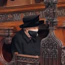 Queen Elizabeth II after taking her seat for the funeral of her husband, the Duke of Edinburgh, in St George's Chapel, Windsor Castle in April.