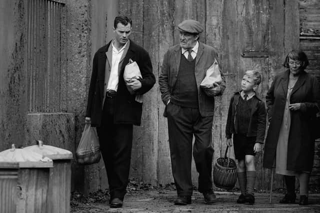 Undated film still handout from Belfast. Pictured: Jamie Dornan as Pa, Ciaran Hinds as Pop, Jude Hill as Buddy and Judi Dench as Granny. PA Feature SHOWBIZ Film Reviews. Picture credit should read: PA Photo/Focus Features, LLC/Rob Youngson. All Rights Reserved. WARNING: This picture must only be used to accompany PA Feature SHOWBIZ Film Reviews.