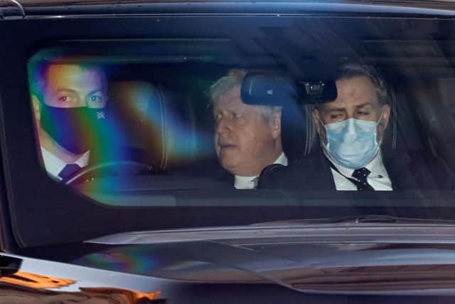 Prime Minister Boris Johnson leaves the Houses of Parliament after the weekly PMQ's on January 12
