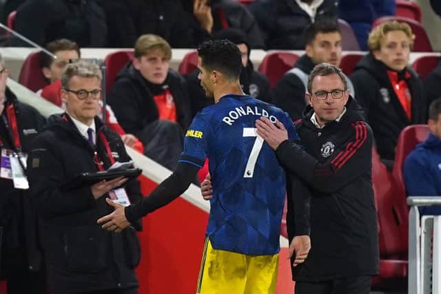 Manchester United manager Ralf Rangnick with Cristiano Ronaldo as he is substituted during the Premier League match at the Brentford Community Stadium. Pic by PA.