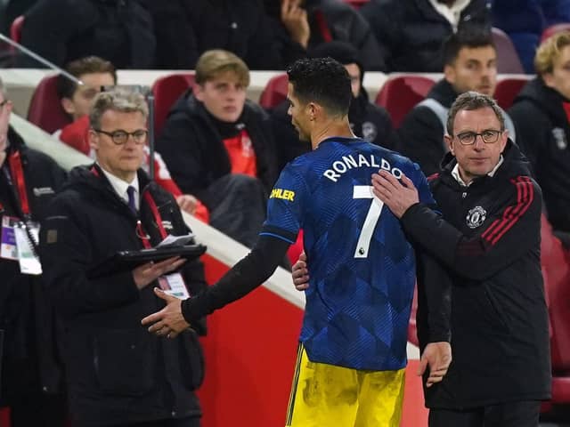 Manchester United manager Ralf Rangnick with Cristiano Ronaldo as he is substituted during the Premier League match at the Brentford Community Stadium. Pic by PA.