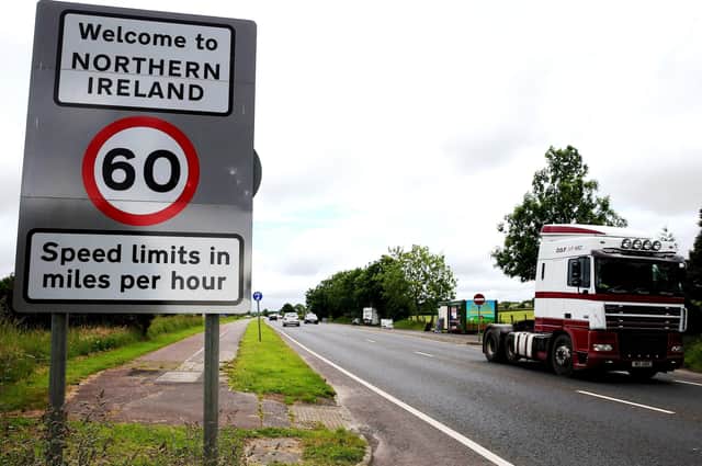Traffic crossing the border between the Republic of Ireland and Northern Ireland in the village of Bridgend, Co Donegal. (Brian Lawless/PA Wire)