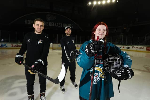 David Goodwin, captain, Belfast Giant, Jeff Mason, assistant coach, Belfast Giants, and Carla Magee, Ice Academy participant. A group of 15 local young people laced up their skates for the first time at The SSE Arena as the fourth Odyssey Ice Academy officially got under way with the Stena Line Belfast Giants. Picture: Kelvin Boyes, Press Eye