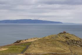 A view from Torr Head on the north Antrim coast looking over the Straits of Moyle towards the tip of the Mull of Kintyre in southwest Scotland which is a distance of 12 miles at its closest.