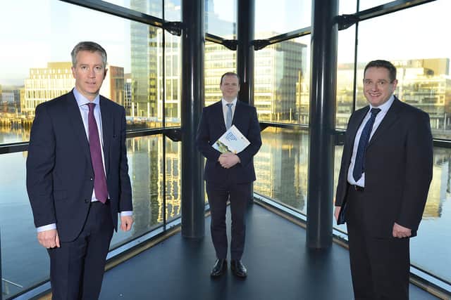 Paul Stapleton, managing director at NIE Networks, Economy Minister Gordon Lyons and John French, chief executive of the Utility Regulator