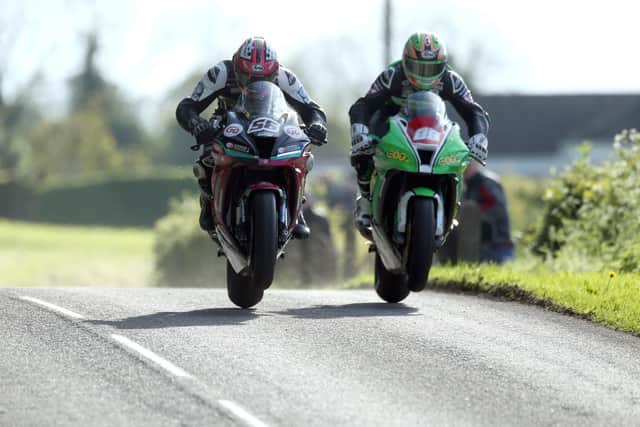 Adam McLean (56) and Derek McGee (86) during practice for the Tandragee 100 in 2019.