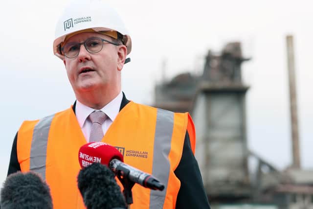 Sir Jeffrey Donaldson speaks to the media during a visit to Budore Quarries outside Belfast on Monday