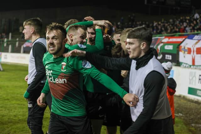 Conor McMenamin (left) celebrates after his late strike earned Glentoran all three points against Coleraine.  Mandatory Credit ©INPHO/Matt Mackey