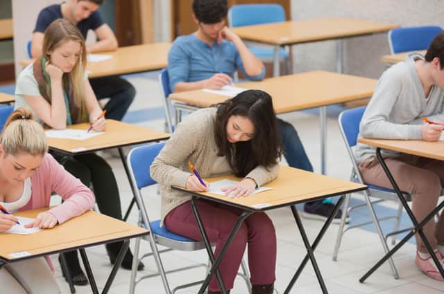 Students sitting an exam. PA generic image