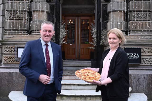Finance Minister Conor Murphy pictured with Carol-Louise Munce at Pizza on the Square, Belfast city centre