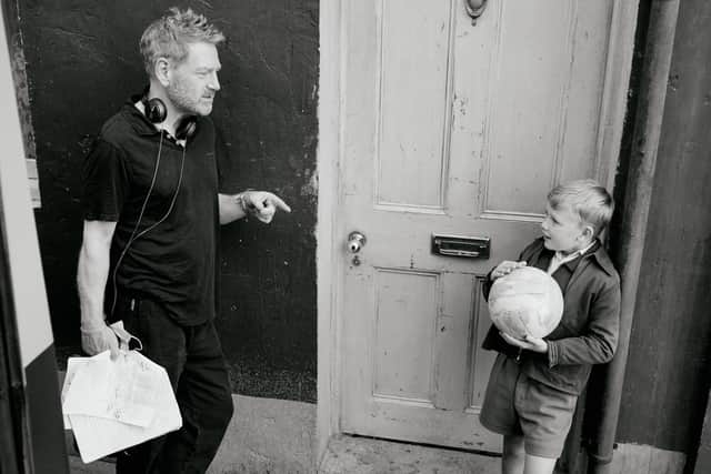 Director Kenneth Branagh (left) and actor Jude Hill (right) on the set of Belfast. PIC: Rob Youngson/Focus Features