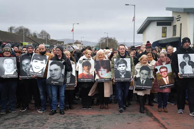 People in the Creggan area of Derry on a remembrance walk to mark the 50th anniversary of Bloody Sunday. Picture date: Sunday January 30, 2022.