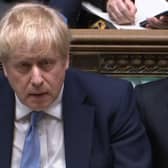 Prime Minister Boris Johnson listens as Labour leader Sir Keir Starmer responds to his statement to MPs in the House of Commons on the Sue Gray report. Picture date: Monday January 31, 2022.