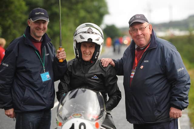 The new Presbyterian moderator is also a race chaplin. The Rev John Kirkpatrick (centre) and his race team, assistant chaplins Pastor Edwin Ewart and the Rev Noel Agnew on the Armoy road race start grid.