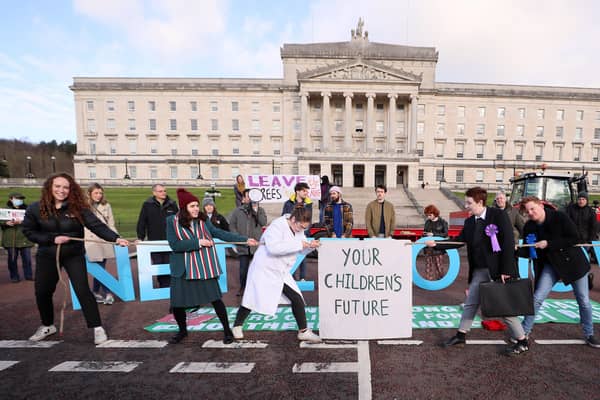 A Climate Coalition NI protest took place outside Parliament Buildings at Stormont yesterday ahead of a vote on setting a target for net zero emissions.  Photo: Jonathan Porter/Presseye