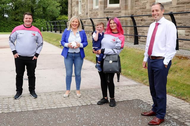 Mairtin Mac Gabhann with son Daithi and partner Seph Ni Mheallain at Stormont with Michelle O’Neill and Paul Givan