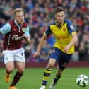 Scott Arfield, during his time at Burnley, coming up against Rangers' new boy Aaron Ramsey