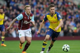 Scott Arfield, during his time at Burnley, coming up against Rangers' new boy Aaron Ramsey