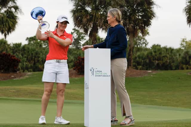 FORT MYERS, FLORIDA - FEBRUARY 05: Leona Maguire of Ireland is presented the Trophy by LPGA commissioner Mollie Marcoux Samaan after winning the LPGA Drive On Championship at Crown Colony Golf & Country Club on February 05, 2022 in Fort Myers, Florida. (Photo by Douglas P. DeFelice/Getty Images)