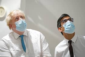 Prime Minister Boris Johnson (left) and Chancellor Rishi Sunak during a visit to the Kent Oncology Centre at Maidstone Hospital in Kent. Picture date: Monday February 7, 2022.