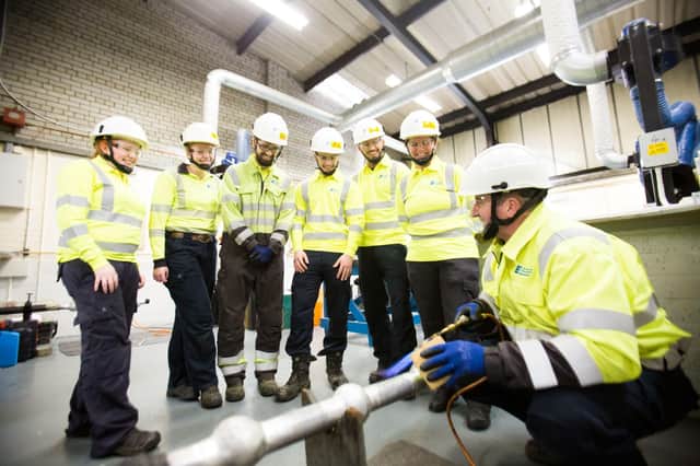 Apprentices at the NIE Networks training school undertaking jointing training
