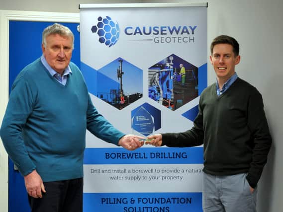 Ivor receiving his award from Darren Mahony, director at Causeway Geotech Limited