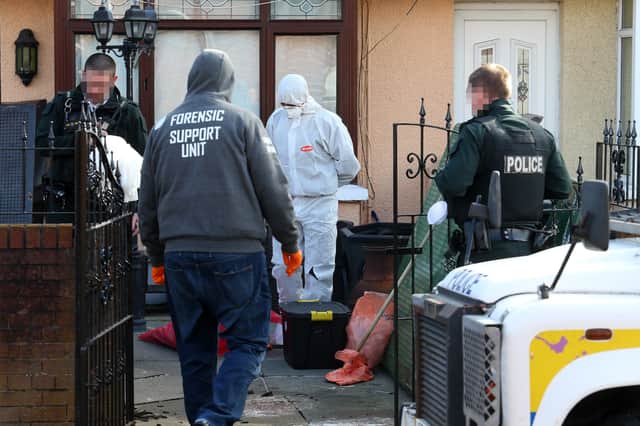 PSNI officers back at the scene of Robbie Lawlor's murder at Etna Drive in Ardoyne in April 2020. Lawlor was shot dead as he arrived at an address in the North Belfast estate.