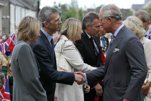 Dr David Johnston greets HRH Prince Charles during a Royal visit to Gracehill in 2011.