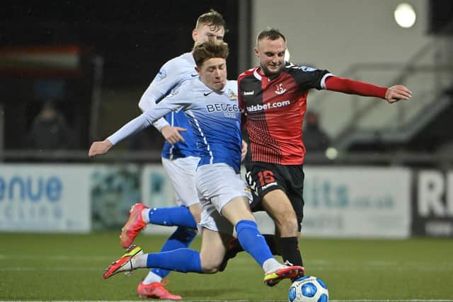 Glenavon’s Jack O’Mahony challenges Crusaders’ Jude Winchester. PICTURE: Stephen Hamilton/Inpho