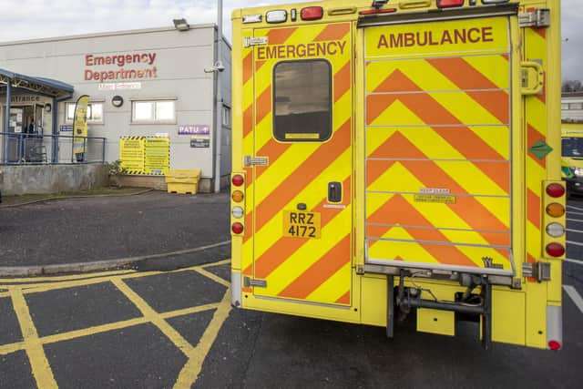 Ambulance parked outside main entrance to the Emergency Department of Dundonald Hospital in Belfast, Northern Ireland.