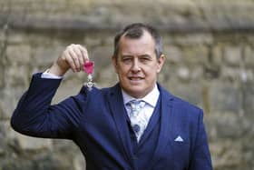 John McGuinness with his MBE (Member of the Order of the British Empire) for services to motorcycle racing following an investiture ceremony by the Princess Royal at Windsor Castle.