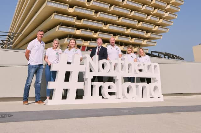 Economy Minister Gordon Lyons with some of the volunteers at the UK Pavilion on Northern Ireland Day at Expo 2020 in Dubai