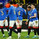 Rangers players celebrate James Tavernier’s opener against Dortmund