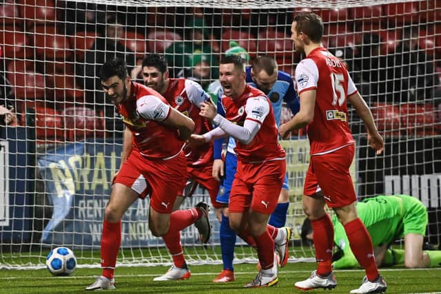 Luke Turner wheels away in celebration after putting Cliftonville ahead against Warrenpoint Town