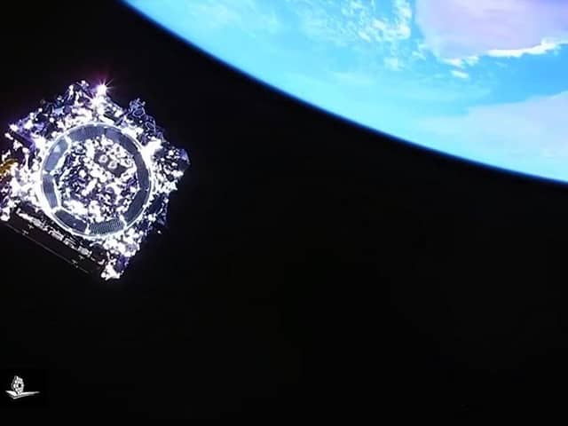 Humanity’s last glimpse of the James Webb Space Telescope as it heads into deep space on Boxing Day; this image was captured by a camera on board the rocket from which the telescope separated