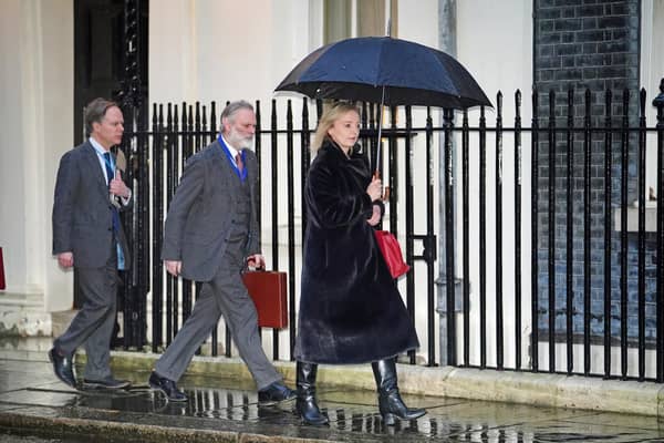 Foreign Secretary Liz Truss and Tim Barrow (second left)), Political Director at the Foreign, Commonwealth and Development Office, arrive in Downing Street, London, for a COBRA meeting called by the Prime Minister to discuss the Russian invasion of Ukraine. Picture date: Thursday February 24, 2022.