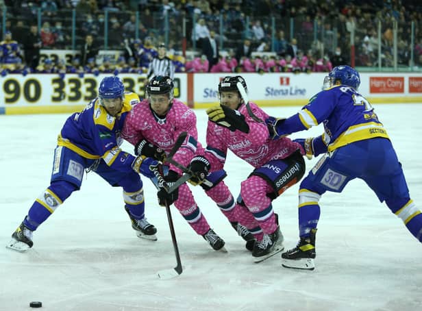 Belfast Giants’ Scott Conway and David Goodwin with Fife Flyers’ James Isaacs during Saturday’s Elite Ice Hockey League game at the SSE Arena, Belfast
