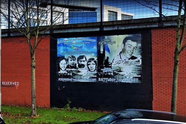 A current mural in the Markets district in Belfast city centre, honouring the OIRA (note the wall next to it is 'reserved' for further murals)