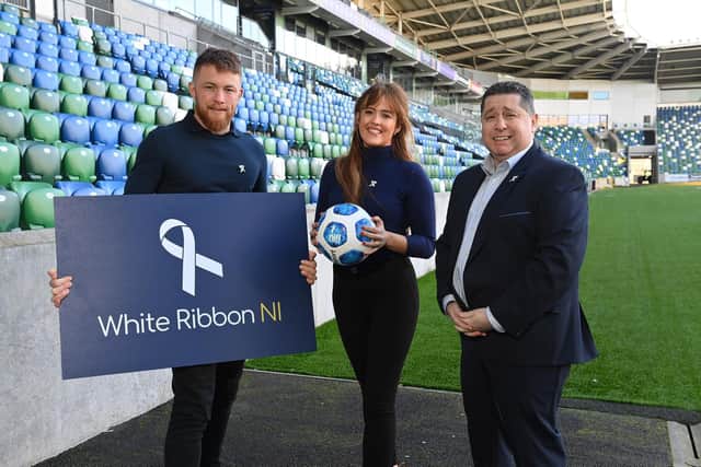 Tahnee McCorry (White Ribbon NI), Vincent McCorry (White Ribbon NI) and Gerard Lawlor (NI Football League) at the announcement of the partnership at the National Football Stadium