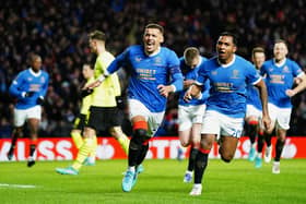 Rangers’ James Tavernier (left) celebrates with Alfredo Morelos after scoring his side’s first goal of the game from the penalty spot during the UEFA Europa League second leg clash with Borussia Dortmund at Ibrox