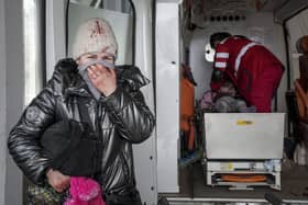 A woman at hospital in Mariupol, Ukraine reacts as paramedics perform CPR on a girl injured in shelling yesterday. The girl did not survive. Healthcare must be a priority of the humanitarian response, says WHO  (AP Photo/Evgeniy Maloletka)