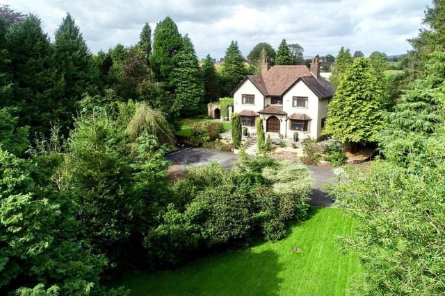 The property has mature gardens laid out in lawns, trees and shubbery providing natural privacy.