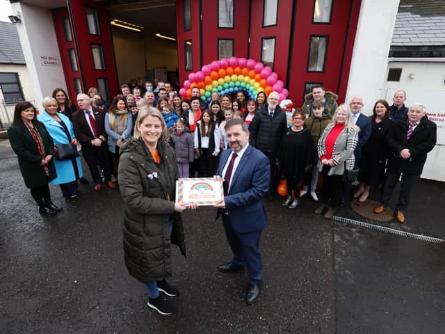 Handout photo of Health Minister Robin Swann at Carnlough Fire Station, County Antrim with Sheenagh Black and members of the local community with a copy of their petition Maggies Call