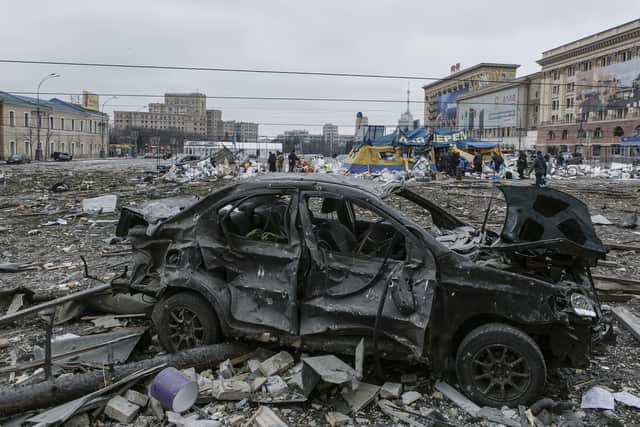 A view of the central square following shelling of the City Hall building in Kharkiv, Ukraine, Tuesday, March 1, 2022. Russia on Tuesday stepped up shelling of Kharkiv, Ukraine's second-largest city, pounding civilian targets there. Casualties mounted and reports emerged that more than 70 Ukrainian soldiers were killed after Russian artillery recently hit a military base in Okhtyrka, a city between Kharkiv and Kyiv, the capital. (AP Photo/Pavel Dorogoy)